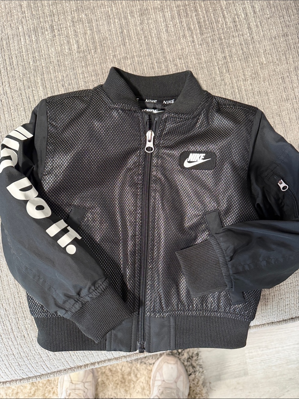 Nike Kids Black Bomber Jacket with 'Just Do It.' Sleeve